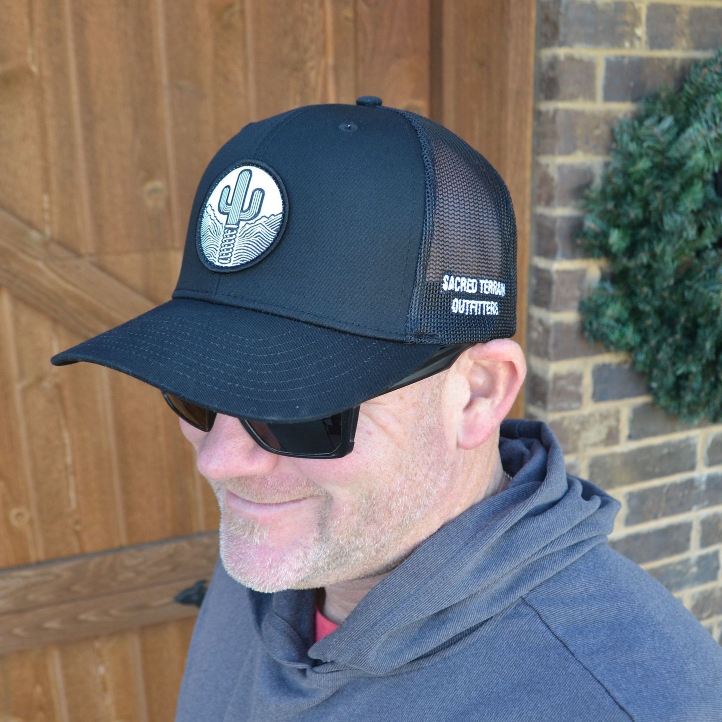 Sacred Stitches 112 Black on Black Trucker Cap - Richardson with Woven Patch