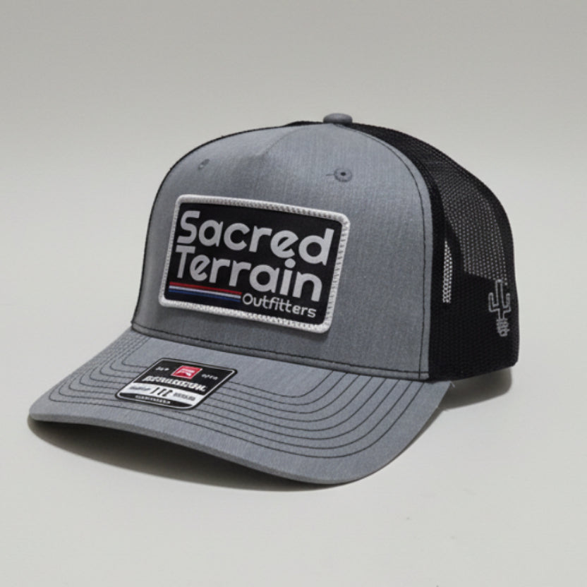 Gray and black cap with branding on a white background
