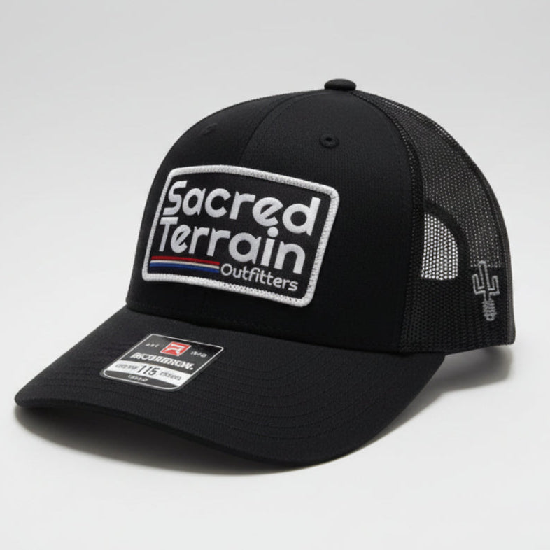 Black cap with a logo on a white surface