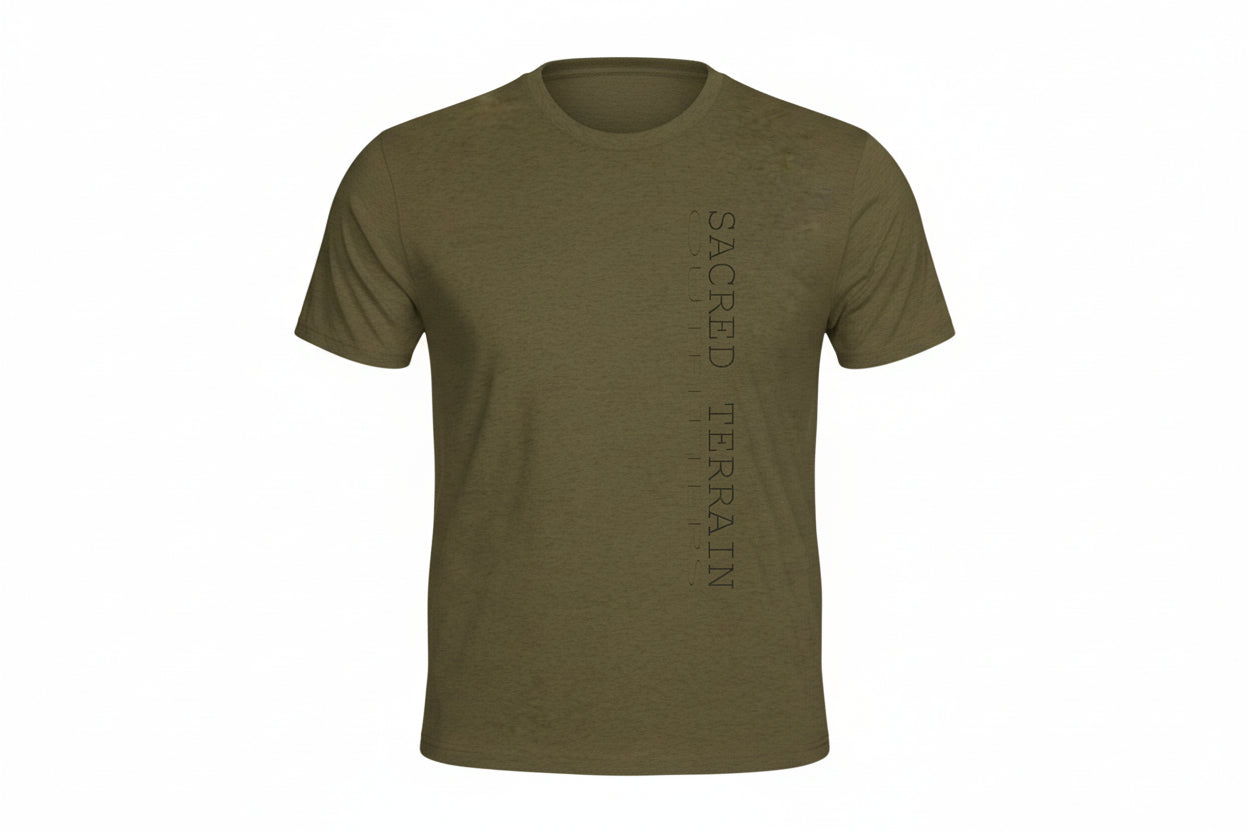 Olive green t-shirt with 'Sacred Terrain' text on a white background