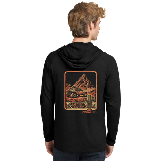 Black hoodie with a graphic design on the back, worn by a person against a white background