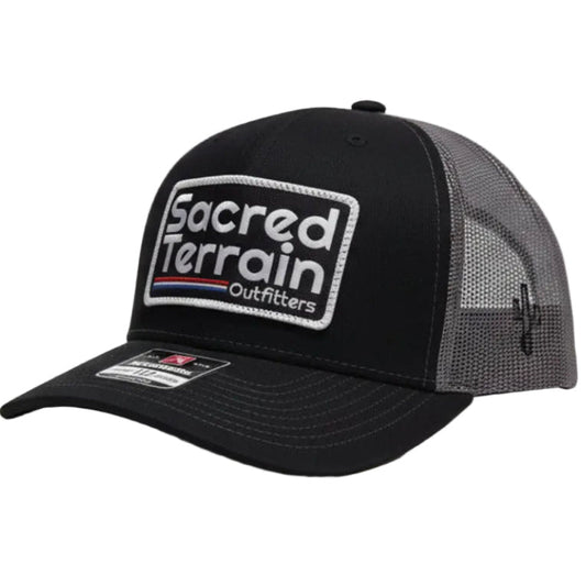 Black cap with a logo on a white surface